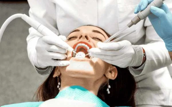 Dentist treating patient